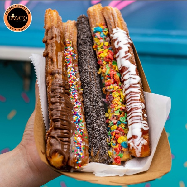  Assorted churros with chocolate, sprinkles, Oreos, fruity cereal, and icing at Dizato Dessert 
Parlour in Perth.